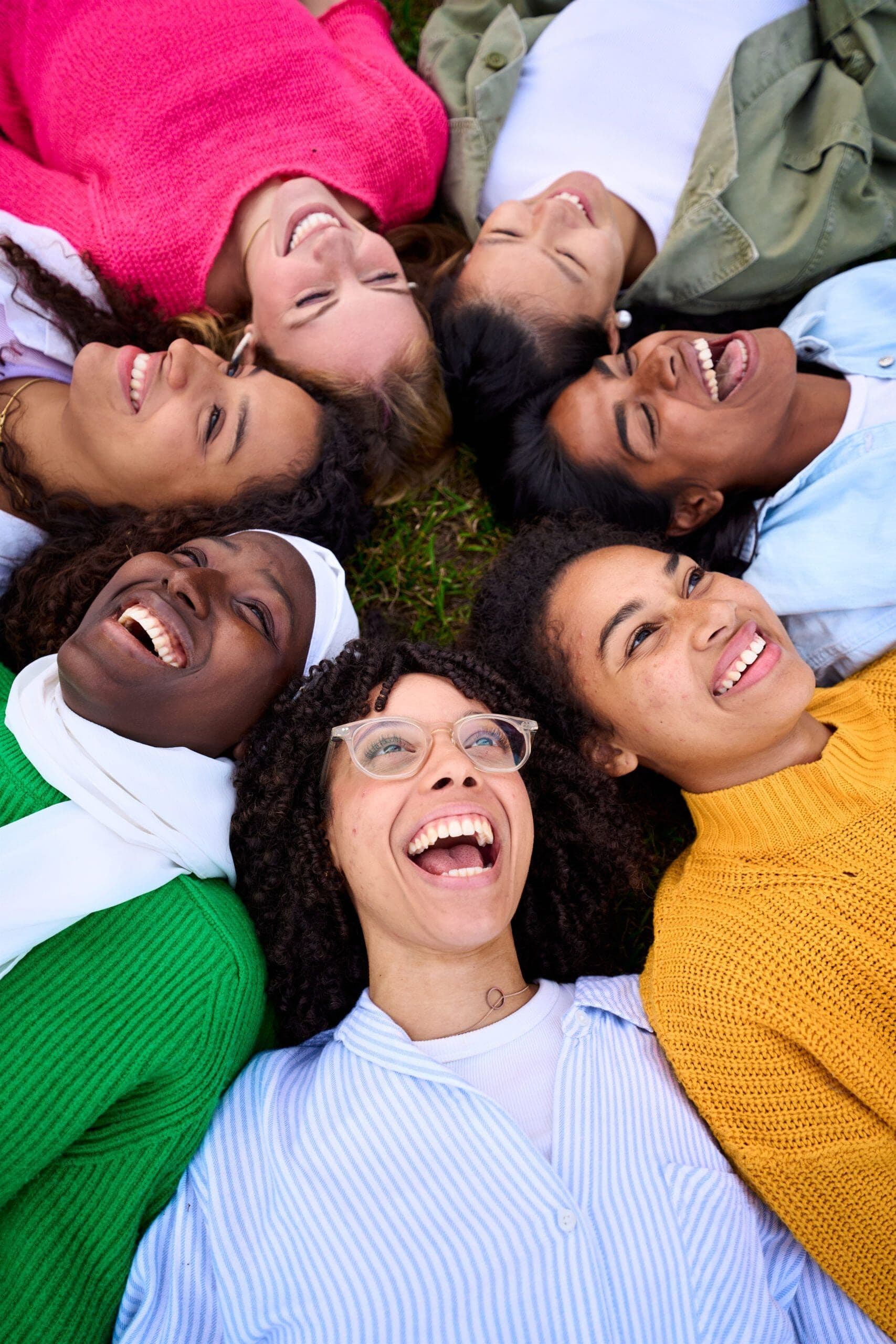 People of diverse backgrounds embracing to symbolize unity, healing, and inclusion during Minority Mental Health Awareness Month.