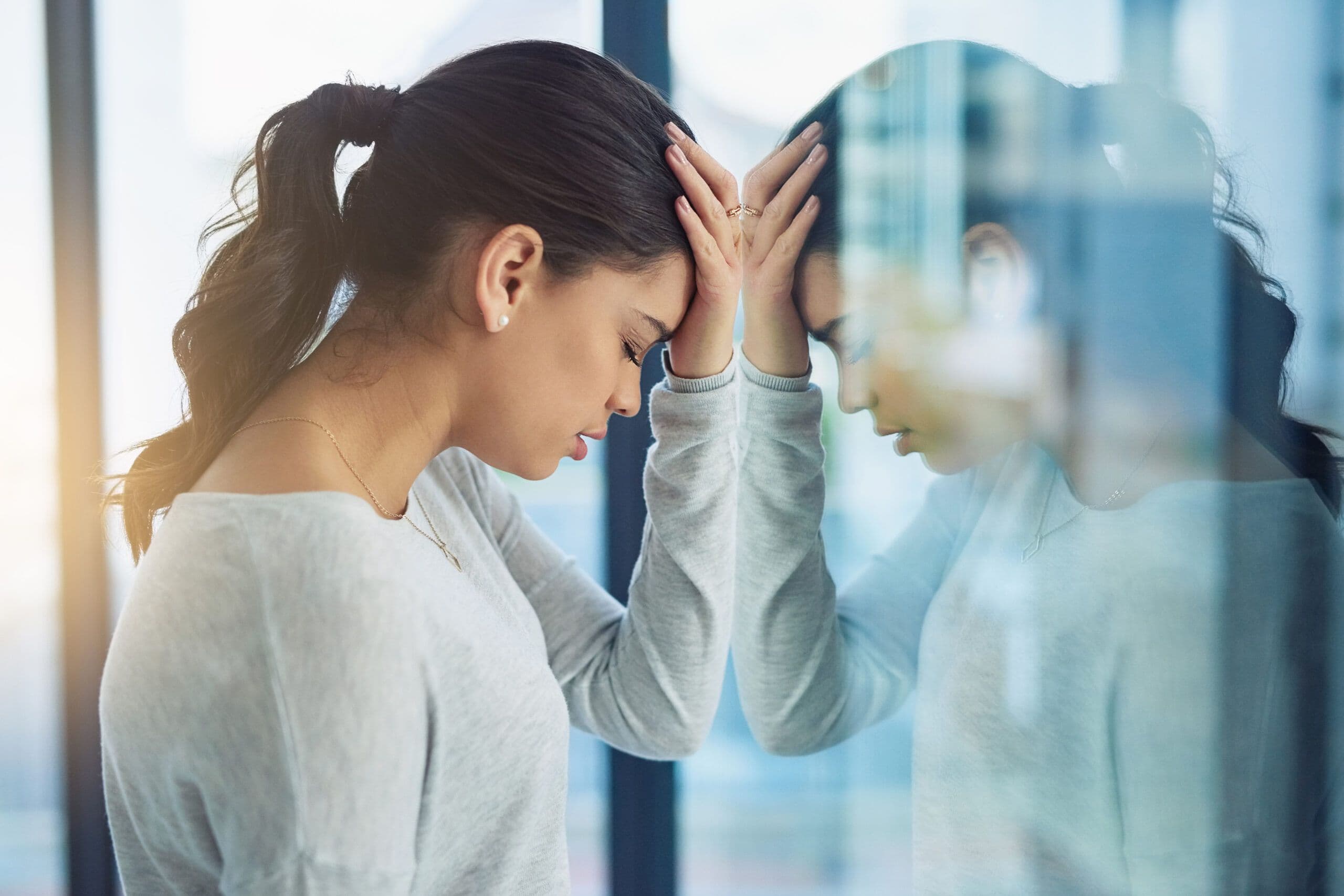 woman experiencing emotional stress during stress awareness month showing mental overload and exhaustion