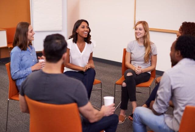 Diverse people sharing in IOP Classes